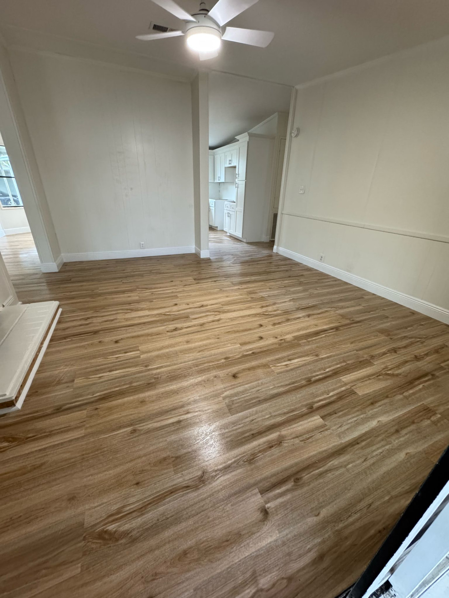 Flooring Installations after — Living room plank flooring